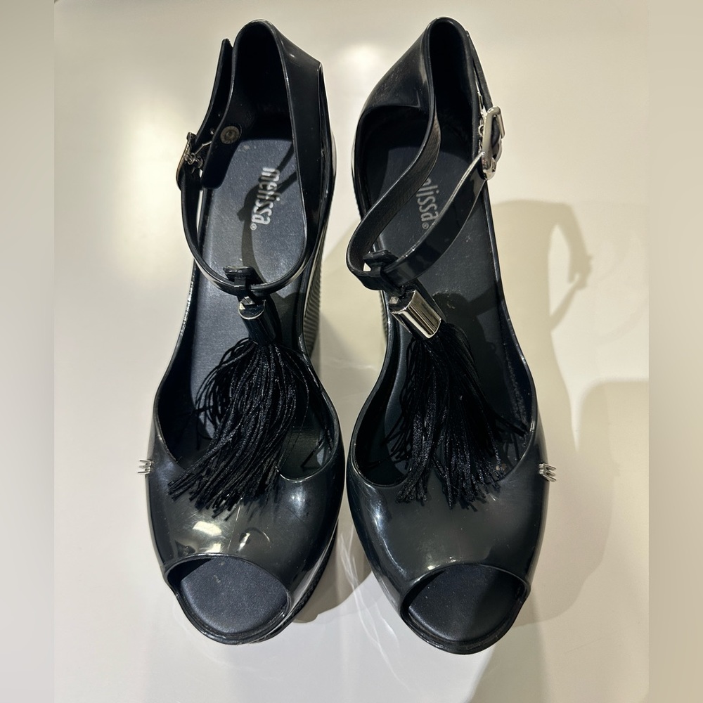 Black Platform Melissa Jelly Wedges (Size 8 USA) with decorative tassle.